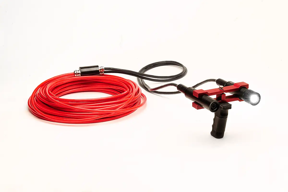Underwater diver camera system with red tether cable and LED dive light on pistol grip mount